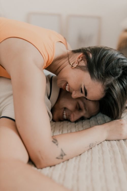 Couple embracing warmly, foreheads touching