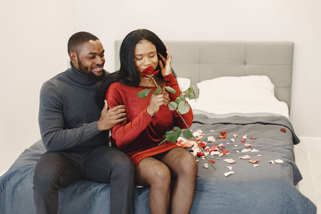 Romantic couple sharing a moment with rose petals