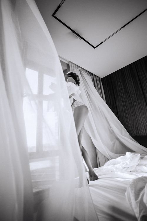 Woman relaxing comfortably at home, embracing self-care and intimacy