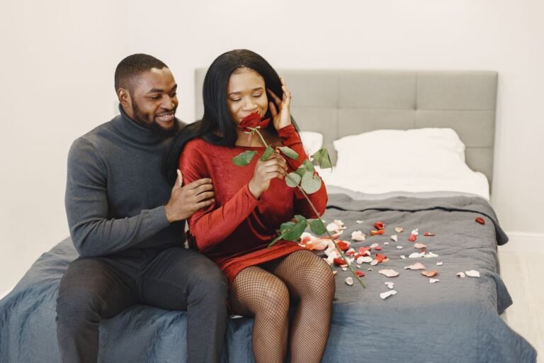Romantic bedroom moment with rose petals